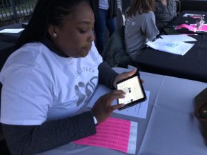 Lung Cancer Alliance Volunteer Checking-In a participant with a Grassroots Unwired Tablet